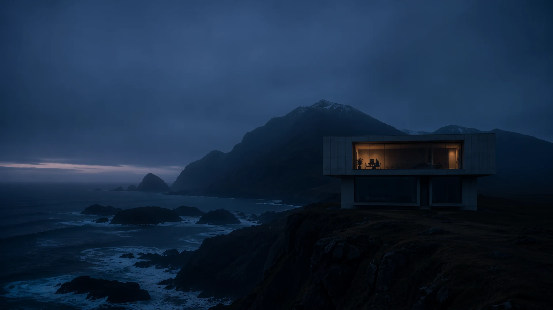 Modern concrete house on a northern cliff overlooking the ocean at dawn